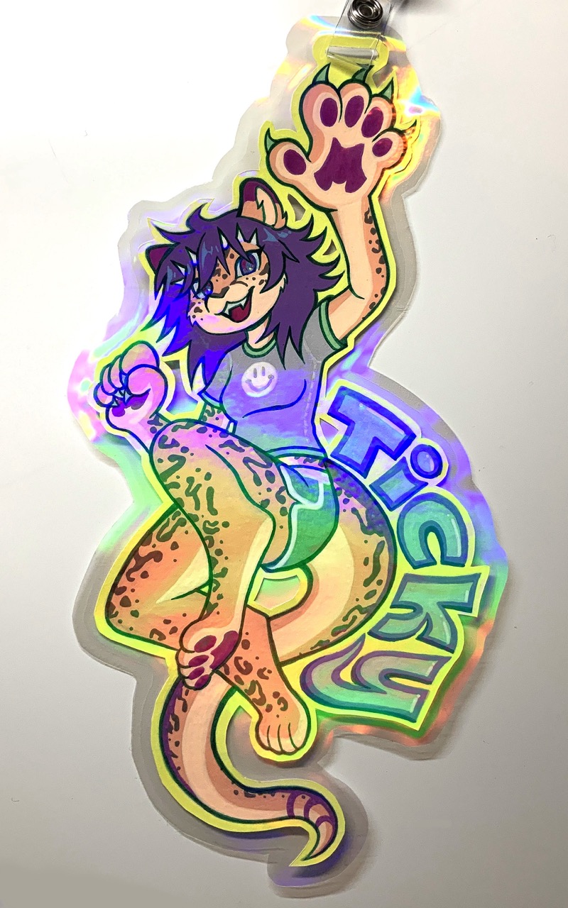 Ticky (a dragon-cheetah hybrid with purple hair) leaps toward the viewer, one big bappy paw waving to the viewer, the other closed, in a cute tee-and-shorts outfit that almost looks like swimwear with a smiley face on the shirt. Ticky is written following the curve of her tail.